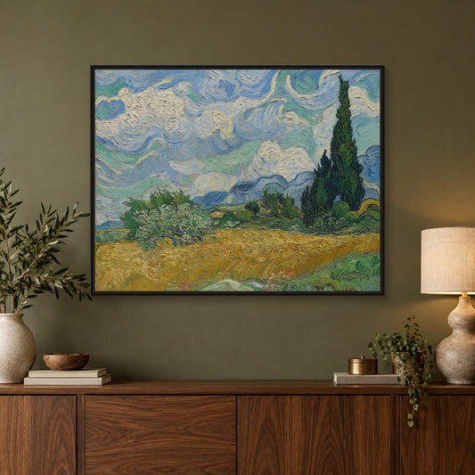Wheat Field with Cypresses by Vincent van Gogh — black frame above a sideboard with lamp