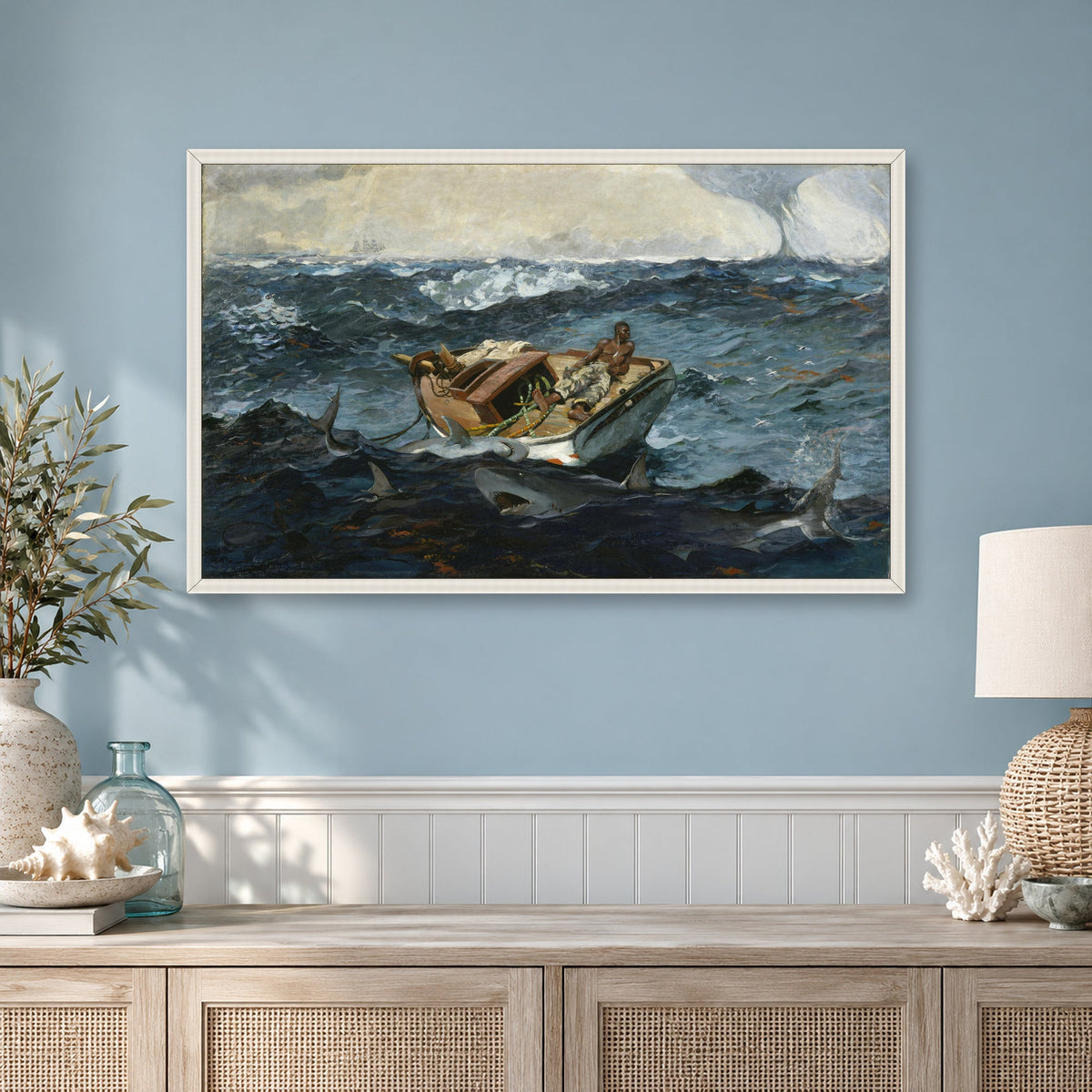 The Gulf Stream by Winslow Homer — white frame in a mist-blue coastal room
