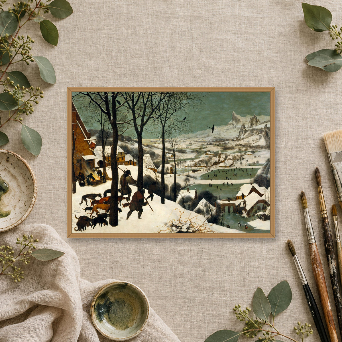 The Hunters in the Snow by Pieter Bruegel the Elder — oak frame, linen flat lay mockup