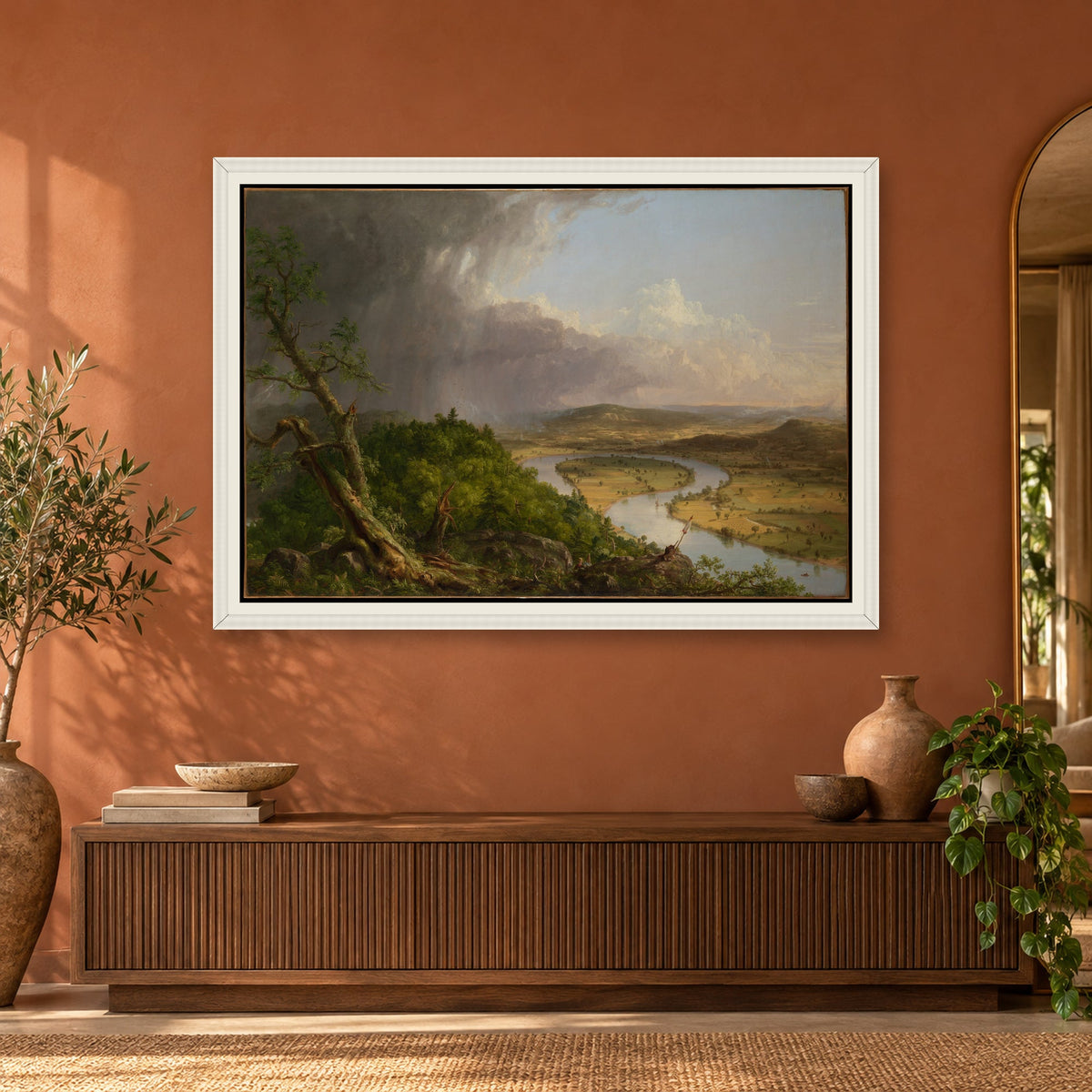 The Oxbow by Thomas Cole — white frame, terracotta room with arched mirror mockup